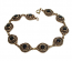 10026 - Bronsarmband med svart onyx sten.